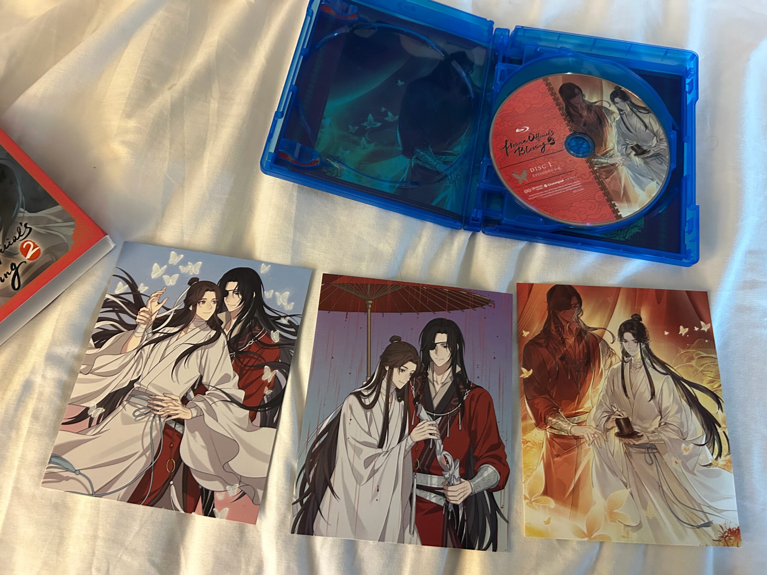 tgcf blu-ray opened with postcards displayed of hua cheng and xie lian